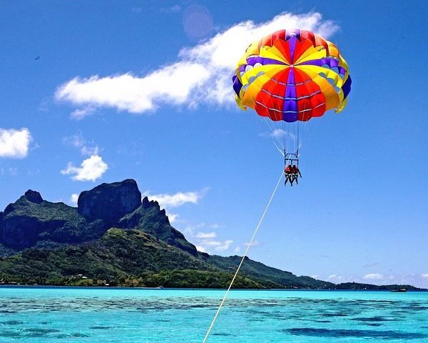 Adventurers enjoying a tandem parasail ride in Hurghada